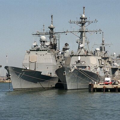 Ticonderoga-class cruiser on left