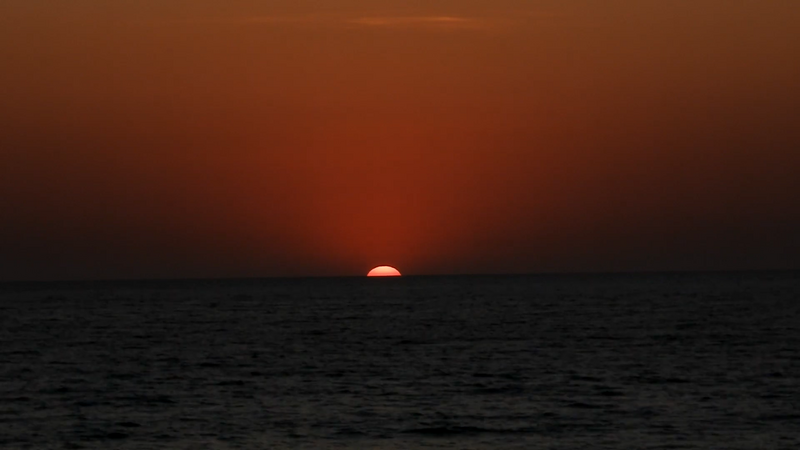 File:Sunset wolfie zoom out.png